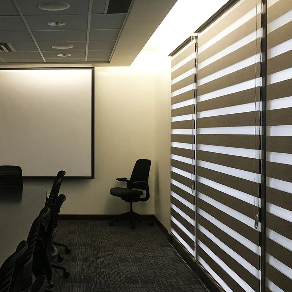 Dark dual shades in a meeting room