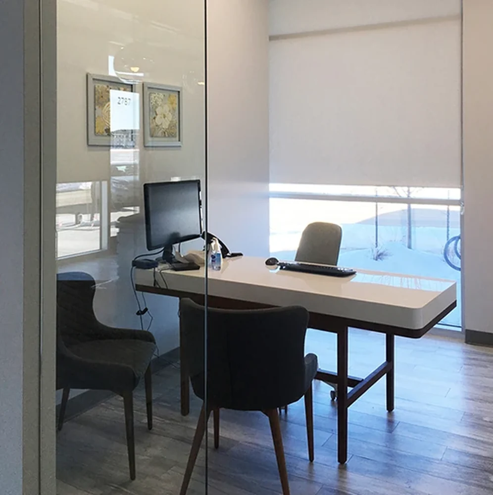 Roller shade behind an office desk